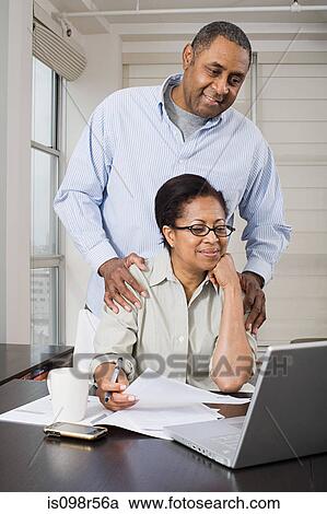 Couple doing home finances View Large Photo Image Stock Image - Couple doing home finances. Fotosearch