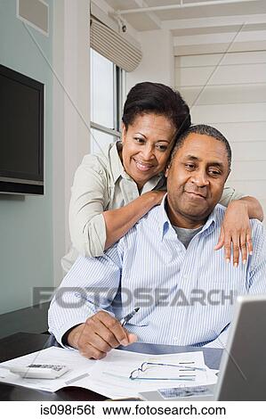 Couple doing home finances View Large Photo Image Stock Photograph - Couple doing home finances. Fotosearch