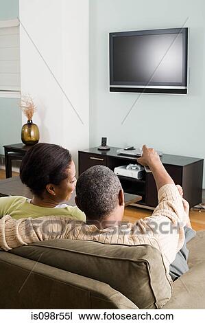 Stock Image - Couple watching television. Fotosearch