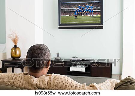 Man watching television View Large Photo Image Stock Photo - Man watching television. Fotosearch