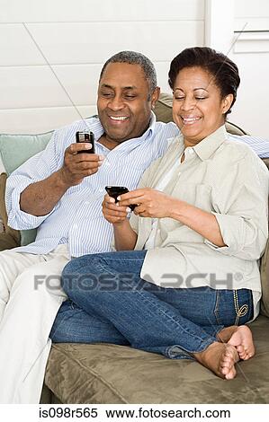 Mature couple with cellphones View Large Photo Image Stock Photography - Mature couple with cellphones. Fotosearch