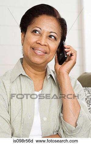 Mature woman on cellphone View Large Photo Image Stock Image - Mature woman on cellphone. Fotosearch
