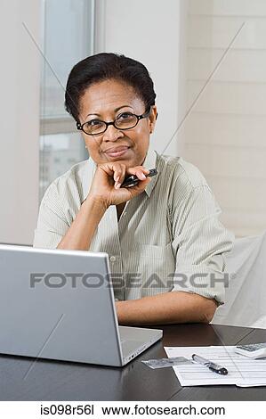Woman doing home finances View Large Photo Image Stock Image - Woman doing home finances. Fotosearch