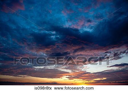 Cloudy sky at sunset View Large Photo Image Stock Photo - Cloudy sky at sunset. Fotosearch