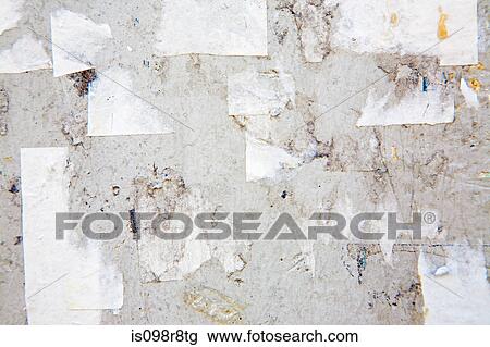 Torn paper on a wall View Large Photo Image Stock Image - Torn paper on a wall. Fotosearch