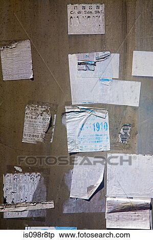 Torn stickers on a wall View Large Photo Image Stock Photography - Torn stickers on a wall. Fotosearch