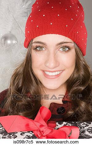 Smiling woman wearing a knit hat View Large Photo Image Stock Photography - Smiling woman wearing a knit hat. Fotosearch