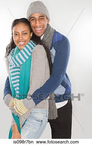 Young couple wearing winter clothes View Large Photo Image Picture - Young couple wearing winter clothes. Fotosearch