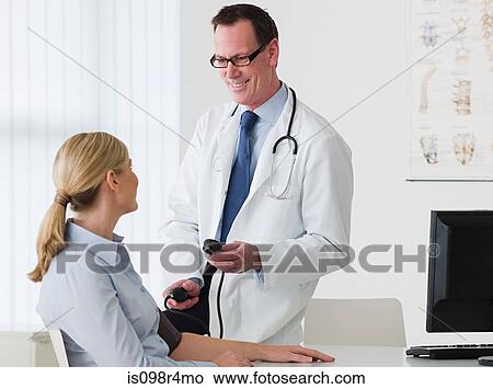 Doctor and patient talking View Large Photo Image Picture - Doctor and patient talking. Fotosearch