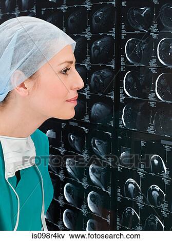 Stock Photo - Female doctors looking at x-rays. Fotosearch