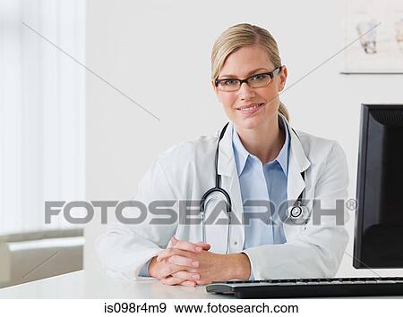 Portrait of a female doctor View Large Photo Image Stock Photo - Portrait of a female doctor. Fotosearch