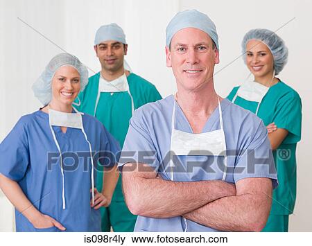 Stock Photo - Portrait of four surgeons. Fotosearch