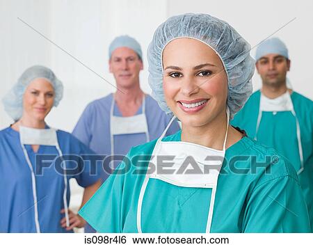 Stock Photograph - Portrait of four surgeons. Fotosearch