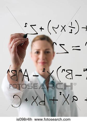 Stock Image - Scientist writing a formula. Fotosearch