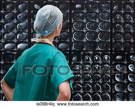 Stock Photography - Surgeon looking at x-rays. Fotosearch
