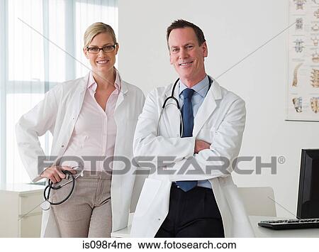 Two doctors in an office View Large Photo Image Stock Image - Two doctors in an office. Fotosearch