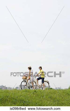 Young couple cycling View Large Photo Image Stock Image - Young couple cycling. Fotosearch