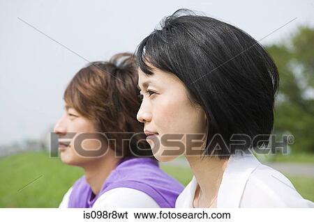Young couple looking away View Large Photo Image Stock Photograph - Young couple looking away. Fotosearch