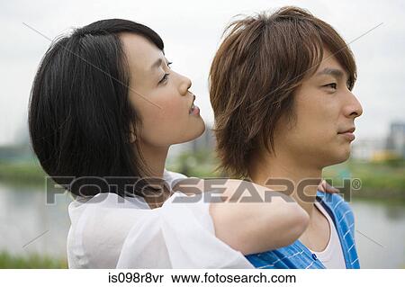 Young couple outdoors View Large Photo Image Stock Photography - Young couple outdoors. Fotosearch