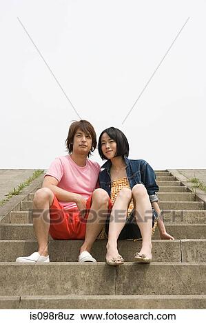 Young couple sitting on steps View Large Photo Image Stock Photo - Young couple sitting on steps. Fotosearch