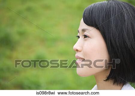 Young woman looking away View Large Photo Image Stock Image - Young woman looking away. Fotosearch