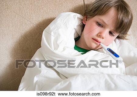 Boy with thermometer in mouth View Large Photo Image Stock Photograph - Boy with thermometer in mouth. Fotosearch
