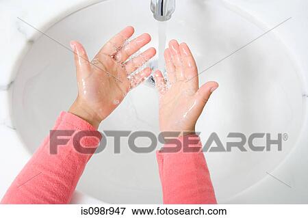 Stock Photo - Child washing their hands. Fotosearch