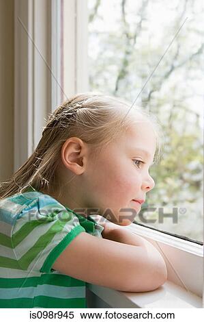 Girl looking out of window View Large Photo Image Stock Photography - Girl looking out of window. Fotosearch