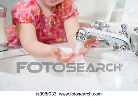 Girl washing her hands View Large Photo Image Stock Image - Girl washing her hands. Fotosearch