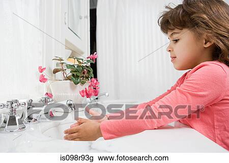 Girl washing her hands View Large Photo Image Stock Image - Girl washing her hands. Fotosearch