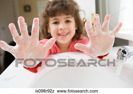 Stock Photo - Girl with soap on her hands. Fotosearch