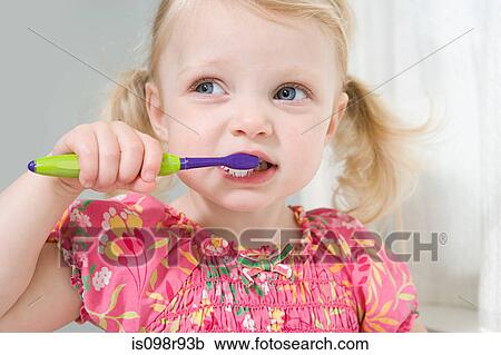 Little girl brushing her teeth View Large Photo Image Stock Image - Little girl brushing her teeth. Fotosearch