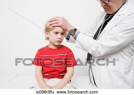 Boy at the doctors View Large Photo Image Stock Photograph - Boy at the doctors. Fotosearch
