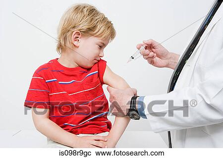 Stock Image - Boy getting immunization. Fotosearch