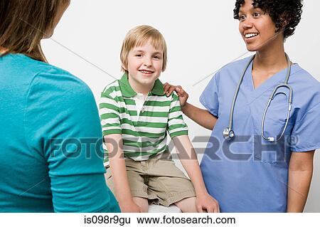 Boy with nurse and parent View Large Photo Image Stock Photograph - Boy with nurse and parent. Fotosearch