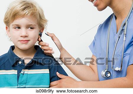 Boy with thermometer in ear View Large Photo Image Stock Photo - Boy with thermometer in ear. Fotosearch