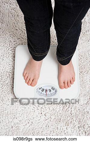 Child on weight scales View Large Photo Image Stock Photograph - Child on weight scales. Fotosearch