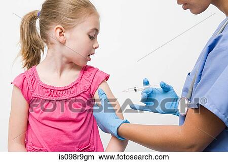 Girl getting immunization View Large Photo Image Picture - Girl getting immunization. Fotosearch