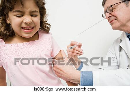 Girl getting immunization View Large Photo Image Picture - Girl getting immunization. Fotosearch