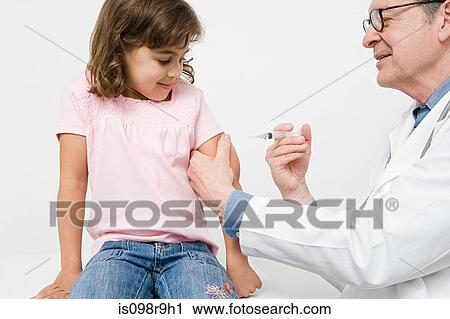 Stock Image - Girl getting immunization. Fotosearch