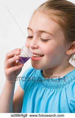 Girl taking medicine View Large Photo Image Stock Photo - Girl taking medicine. Fotosearch