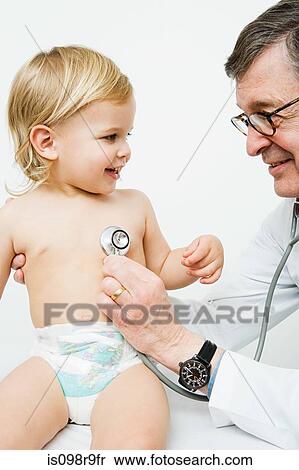 Little boy and doctor with stethoscope View Large Photo Image Stock Photography - Little boy and doctor with stethoscope. Fotosearch