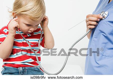 Little boy and nurse with stethoscope View Large Photo Image Stock Photo - Little boy and nurse with stethoscope. Fotosearch