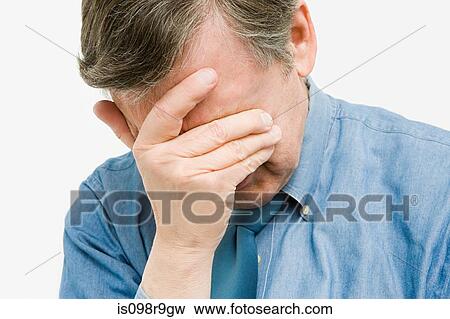 Man with hand over face View Large Photo Image Stock Photo - Man with hand over face. Fotosearch