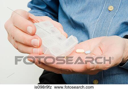 Man with tablets View Large Photo Image Stock Photo - Man with tablets. Fotosearch