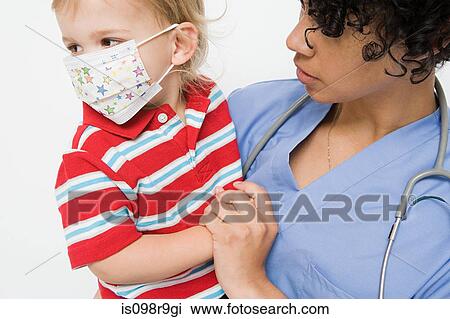Nurse and little boy wearing mask View Large Photo Image Stock Image - Nurse and little boy wearing mask. Fotosearch