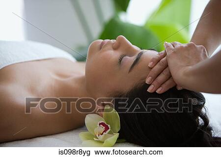 Stock Image - Woman having a head massage. Fotosearch