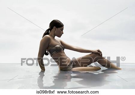 Young woman in water View Large Photo Image Stock Image - Young woman in water. Fotosearch