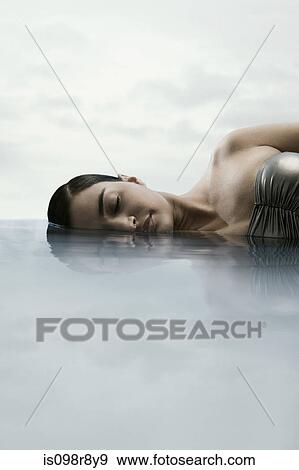 Young woman in water View Large Photo Image Stock Photo - Young woman in water. Fotosearch