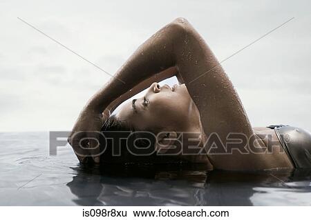 Young woman in water View Large Photo Image Stock Photograph - Young woman in water. Fotosearch